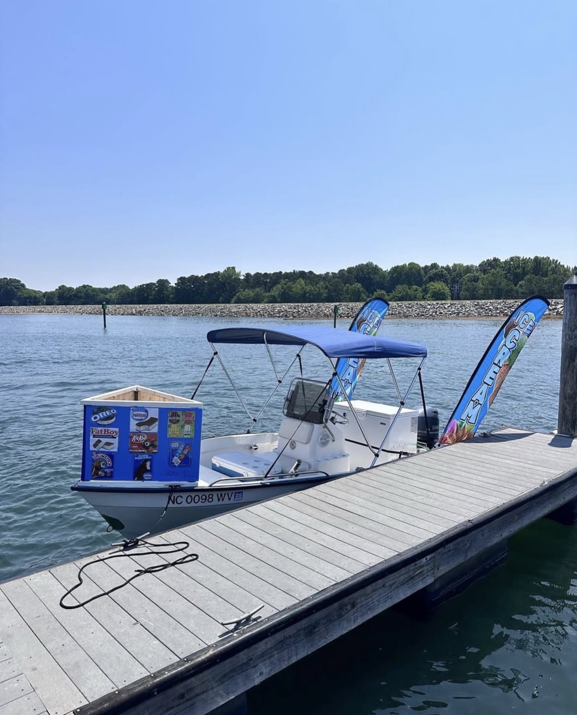 The Ice Cream Boat serving a family at their dock